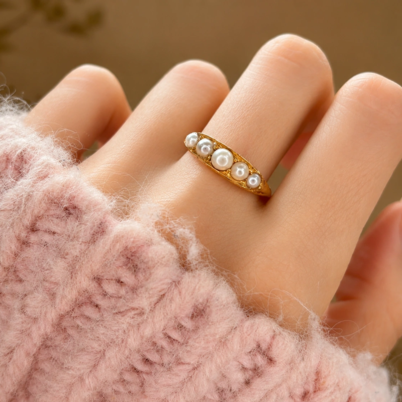 Victorian seed pearl half hoop ring in 18ct gold dated 1899. For sale in Leeds shown on a model's hand
