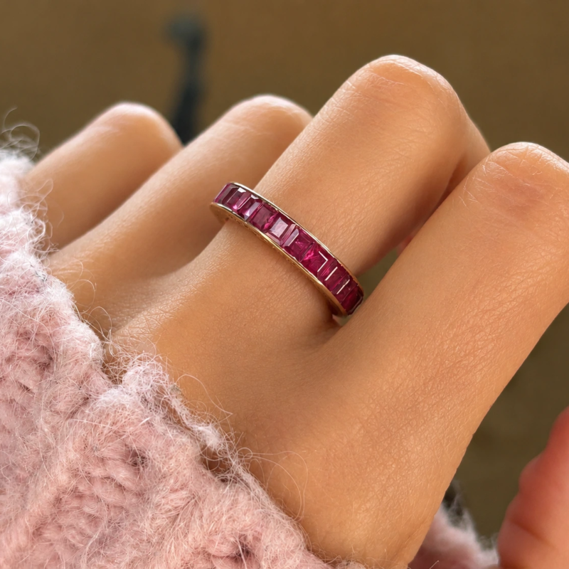 art deco 14ct rose gold ruby full eternity ring for sale in Leeds shown on hand
