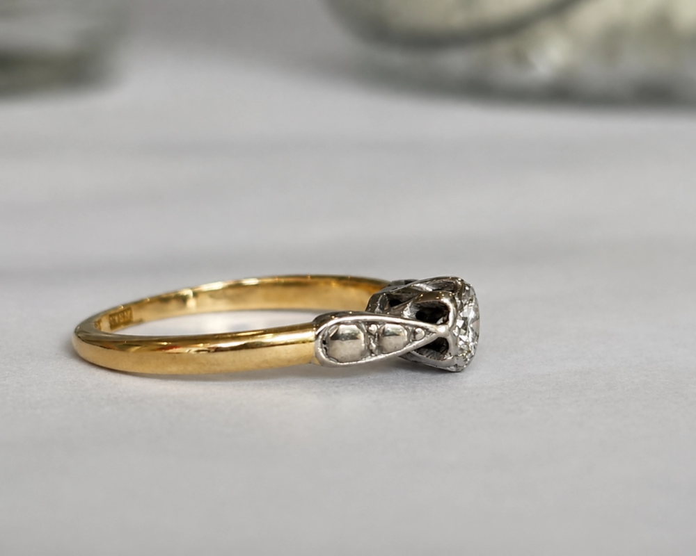 vintage diamond solitaire in platinum setting dated 1958 for sale in Leeds, on model, showing side of the ring