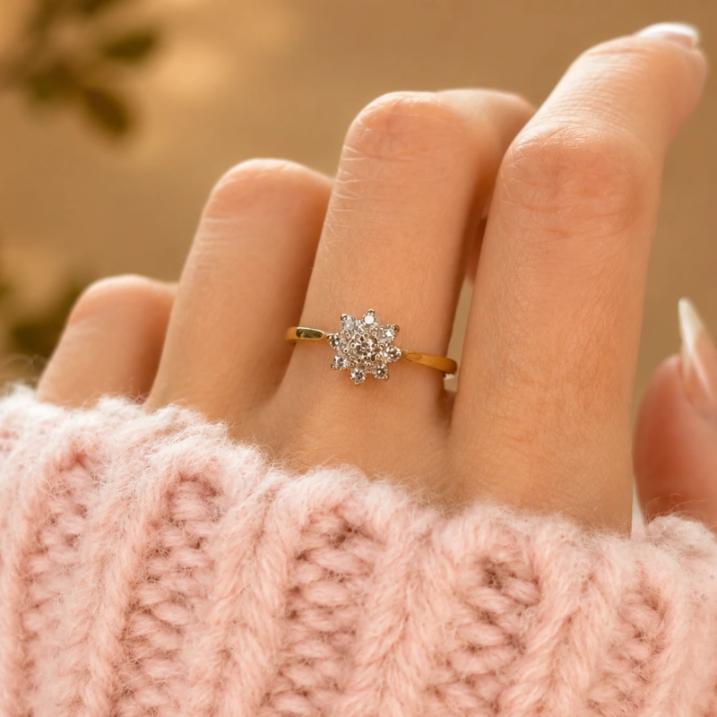 vintage star shaped diamond cluster ring in 18ct yellow gold for sale in Leeds shown on model's hand