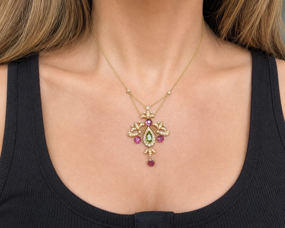 antique Edwardian suffragette necklace in 15ct gold with peridot, amethyst and seed pearl in its orginal box for sale in Leeds, shown on model's neck