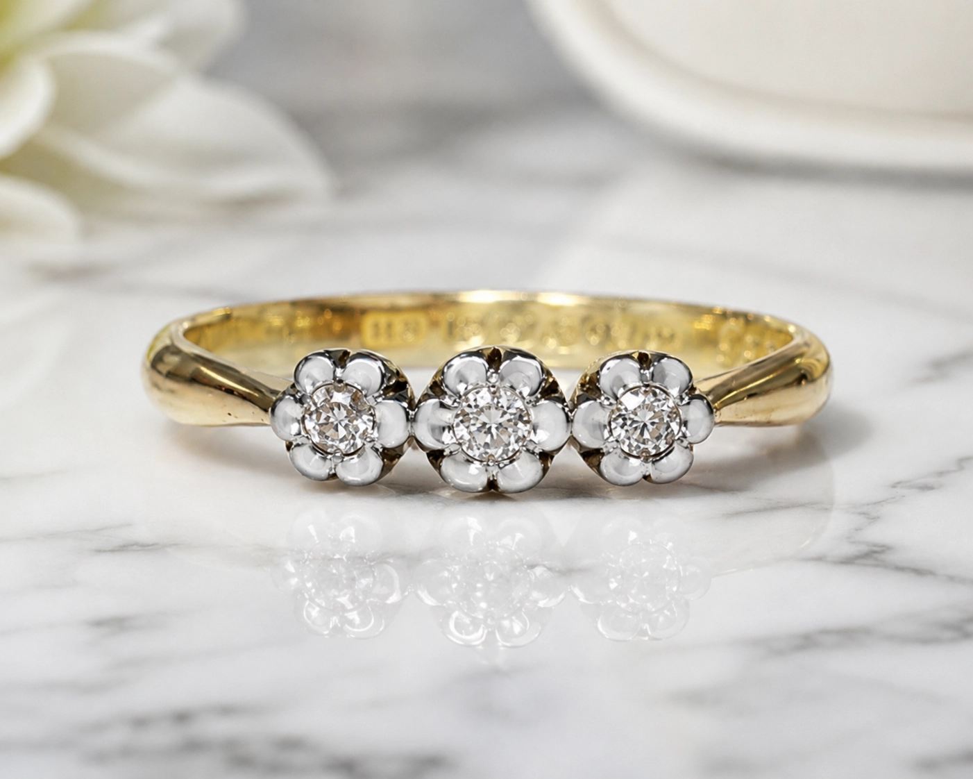 antique 1930s three stone diamond cluster ring in 18ct yellow gold and platinum for sale in Leeds
