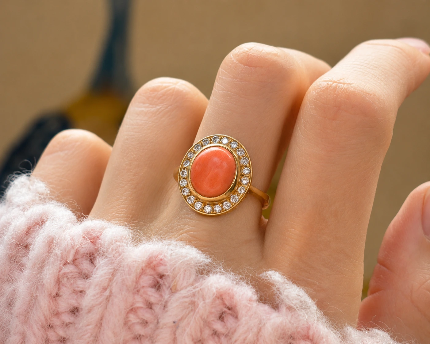 vintage coral ring on hand