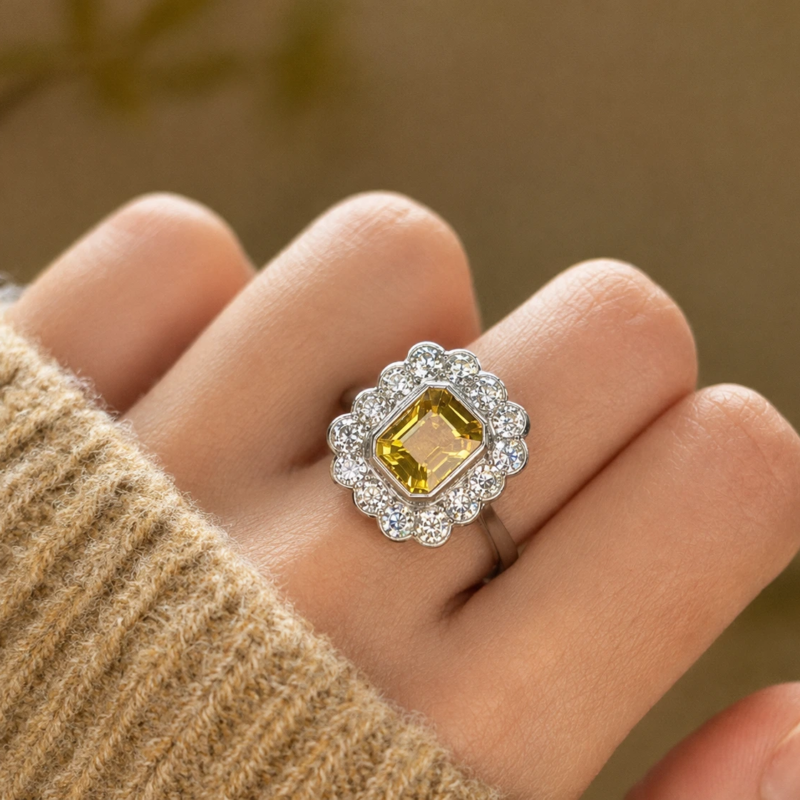 3ct yellow sapphire and diamond cluster ring for sale in Leeds shown on model's hand