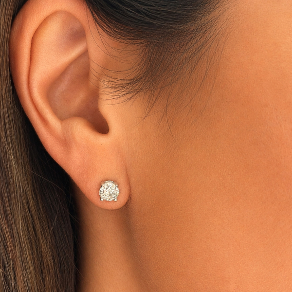vintage 1.66ct diamond studs in 18ct white gold circa 1970s for sale in Leeds in model's ear