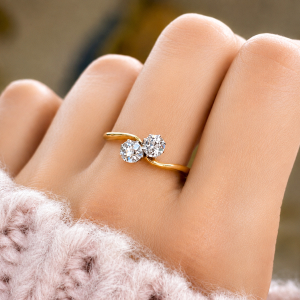 Antique 1930s diamond toi et moi diamond ring with approx 0.4ct in 18ct yellow gold for sale in Leeds, shown on a model's hand
