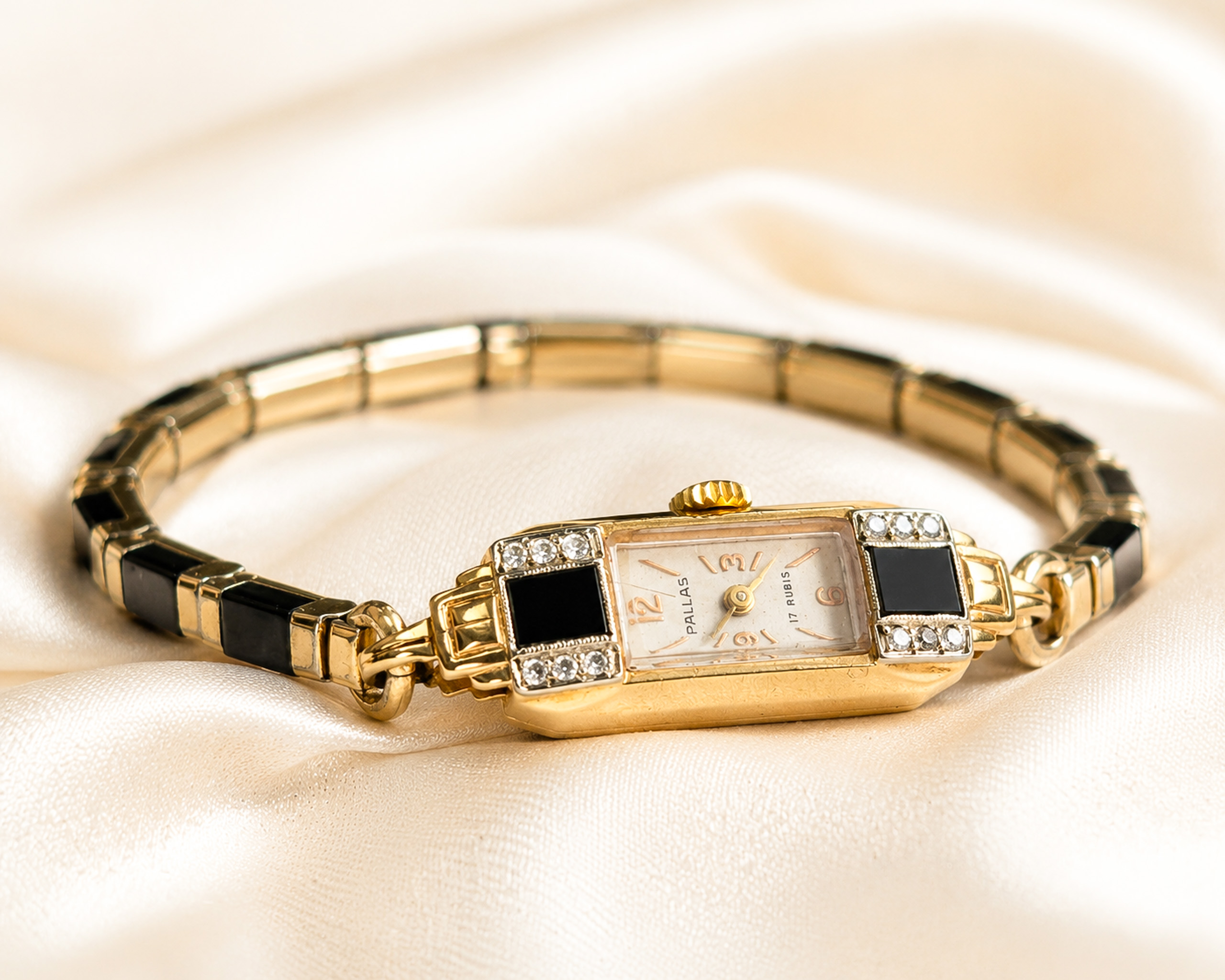 1940s vintage cocktail watch by Pallas, with onyx and diamond in 14ct gold for sale in Leeds