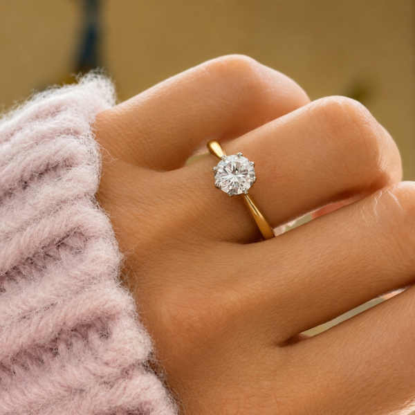 antique Art Deco 1ct diamond solitaire ring in 18ct yellow gold and platinum for sale in Leeds shown on a model's hand