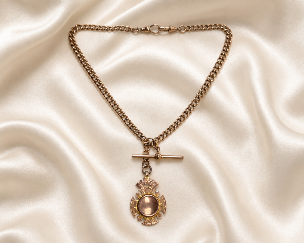 Edwardian albert chain antique Edwardian 9ct gold albert chain with medal, t bar and dog clips
