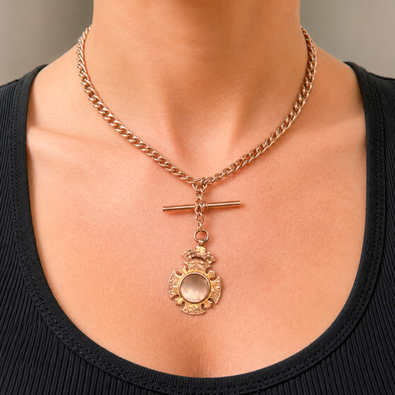 antique Edwardian 9ct gold albert chain with medal, t bar and dog clips on model neck