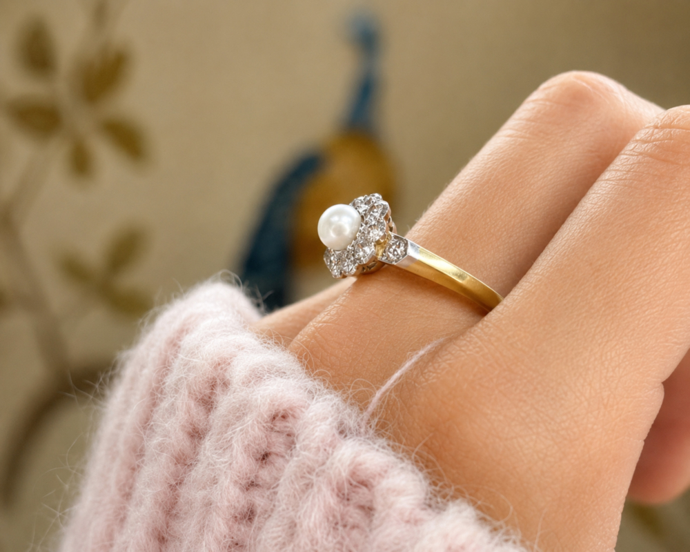 Edwardian pearl and old cut diamond ring in 18ct yellow gold and platinum, for sale in Leeds. Showing side profile of the ring on a model's hand