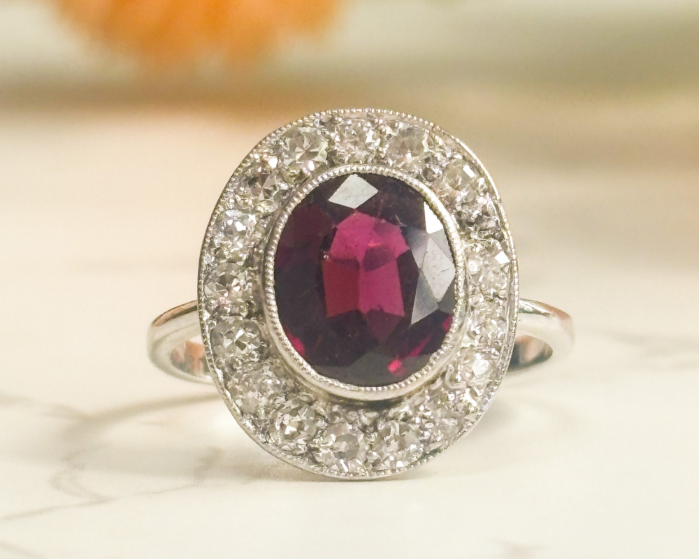 Art Deco garnet and diamond cluster ring in 18ct white gold and platinum for sale in Leeds, UK