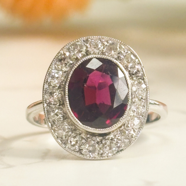 Art Deco garnet and diamond cluster ring in 18ct white gold and platinum for sale in Leeds, UK