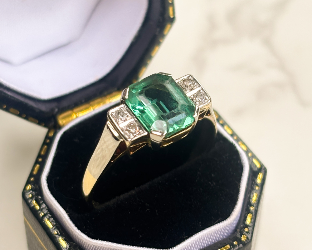 antique Art Deco green tourmaline and diamond ring in 14ct gold and platinum for sale in Leeds, shown in a black ring box
