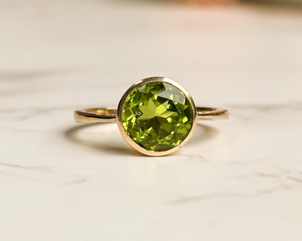 peridot ring modern 9ct gold peridot ring with bezel setting for sale in Leeds