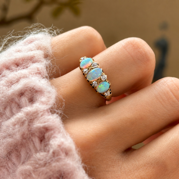 antique Victorian opal and diamond ring im 18ct yellow gold for sale in Leeds shown on model's hand