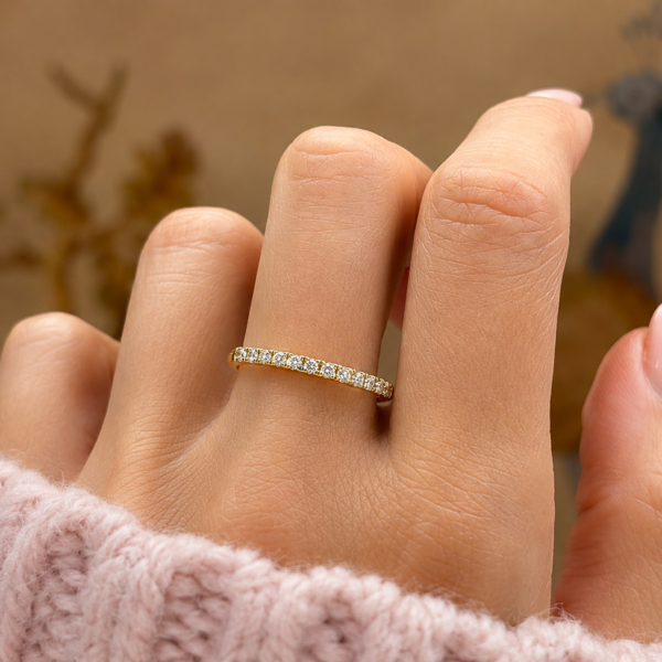18ct gold diamond half eternity ring for sale in Leeds, shown on a woman's hand