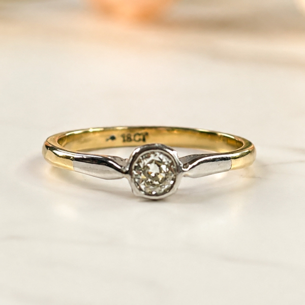 Art Deco diamond solitaire ring in 18ct gold with a bezel set diamond for sale in Leeds