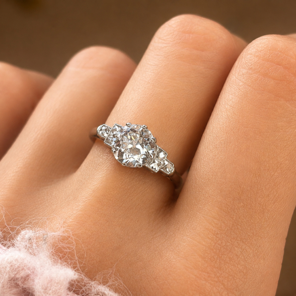 Art Deco 1.5ct diamond solitaire ring VVS1 clarity in platinum. Old cut centre stone and french cut side diamonds. For sale in Leeds, shown on a model's hand