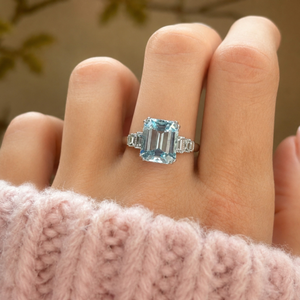 art deco style aquamarine and diamond ring in platinum for sale in Leeds, shown on model hand