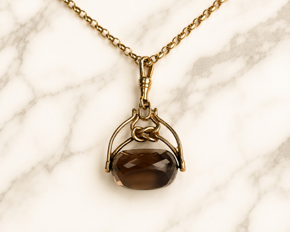gold chain and fob close uo vintage smoky quartz fob on 9ct gold chain