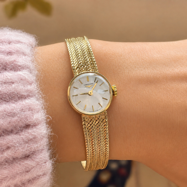 vintage 9ct gold Longines wristwatch dated 1966. For sale in Leeds. shown on model's wrist