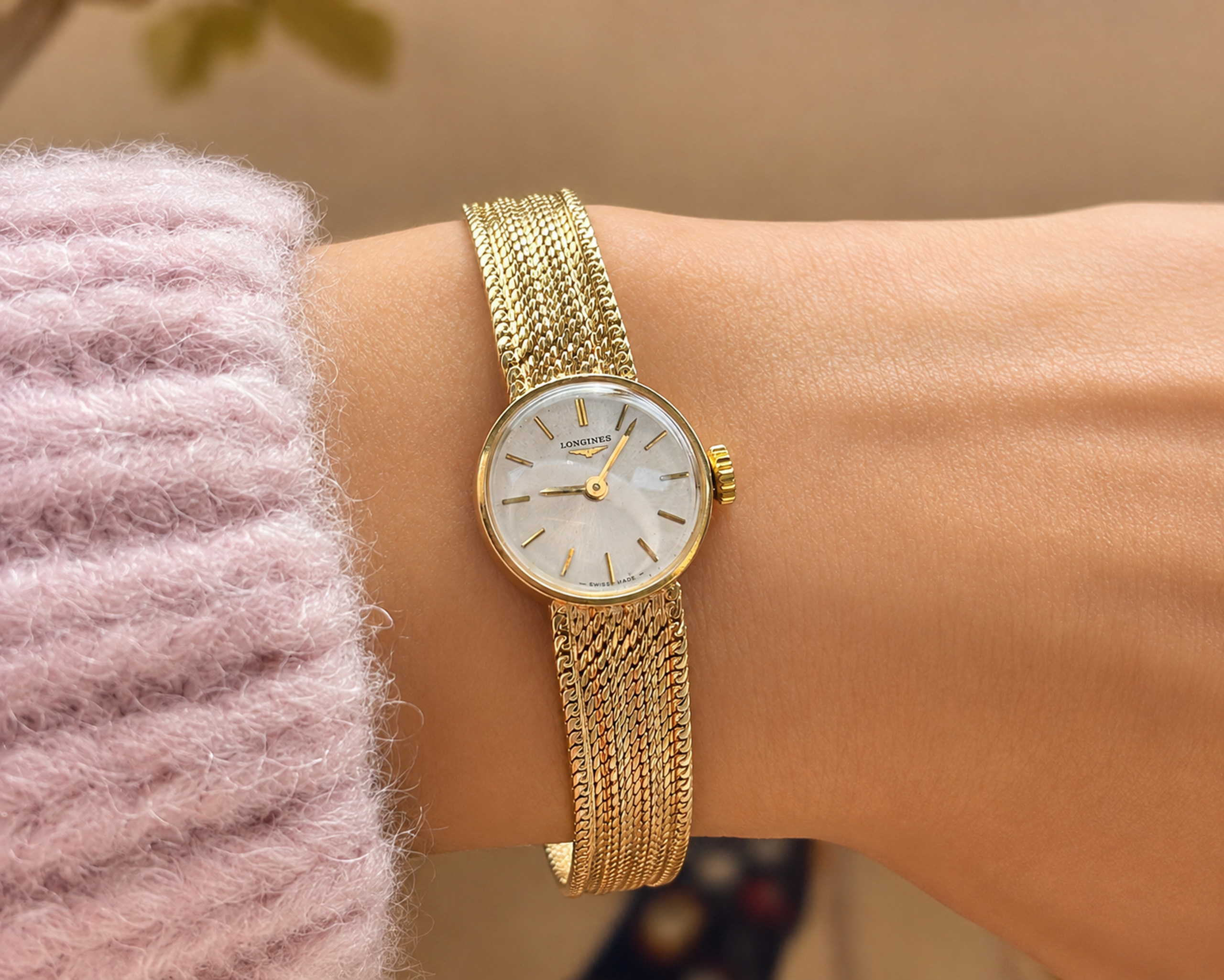 longines watch on hand