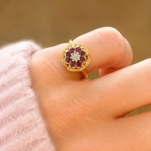 vintage ruby and diamond cluster ring in 18ct yellow gold circa 1950s for sale in Leeds, shown on model's hand