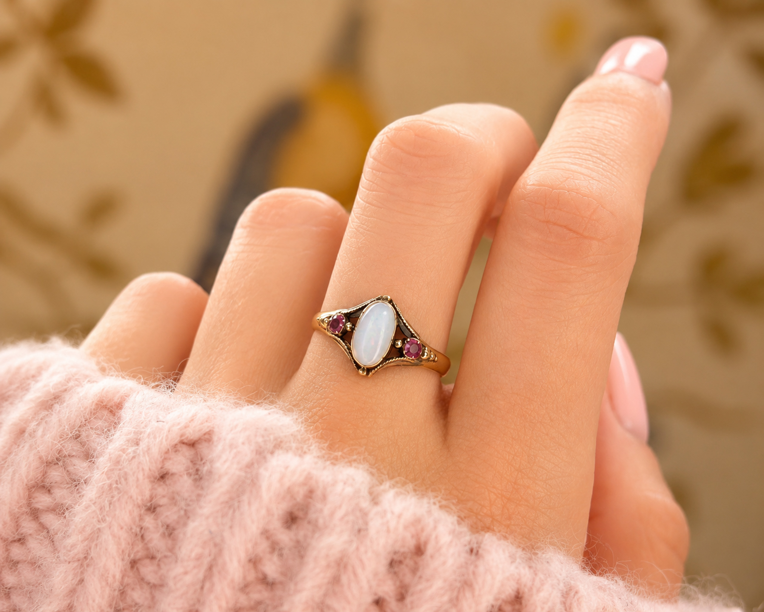 opal and ruby ring on hand