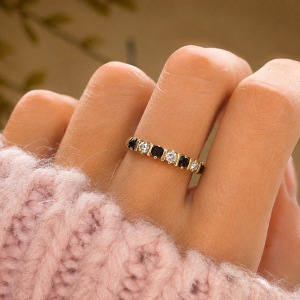 vintage sapphire stacking ring set with diamonds in 9ct gold for sale in Leeds, shown on a model's hand