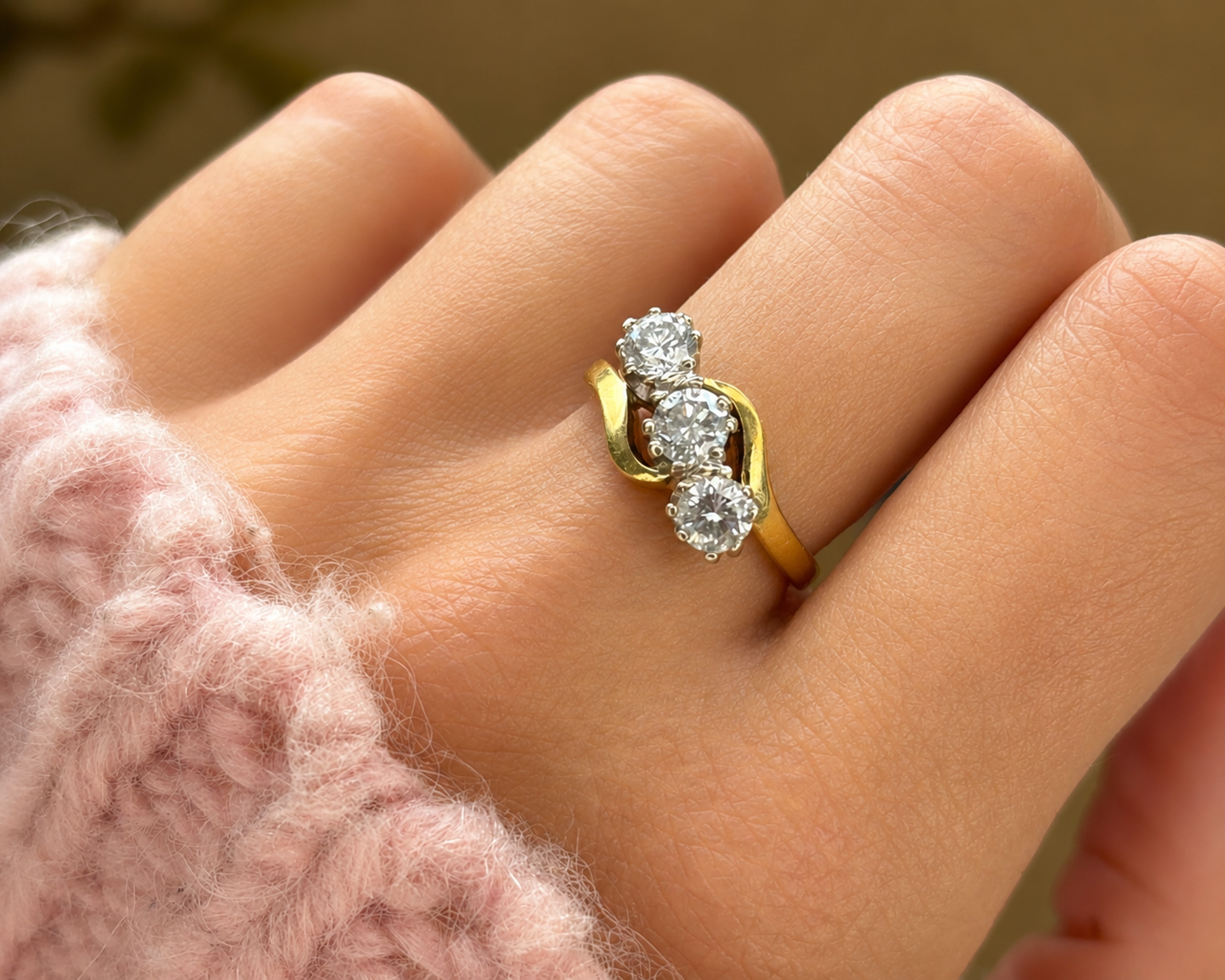 three stone bypass ring on hand 2