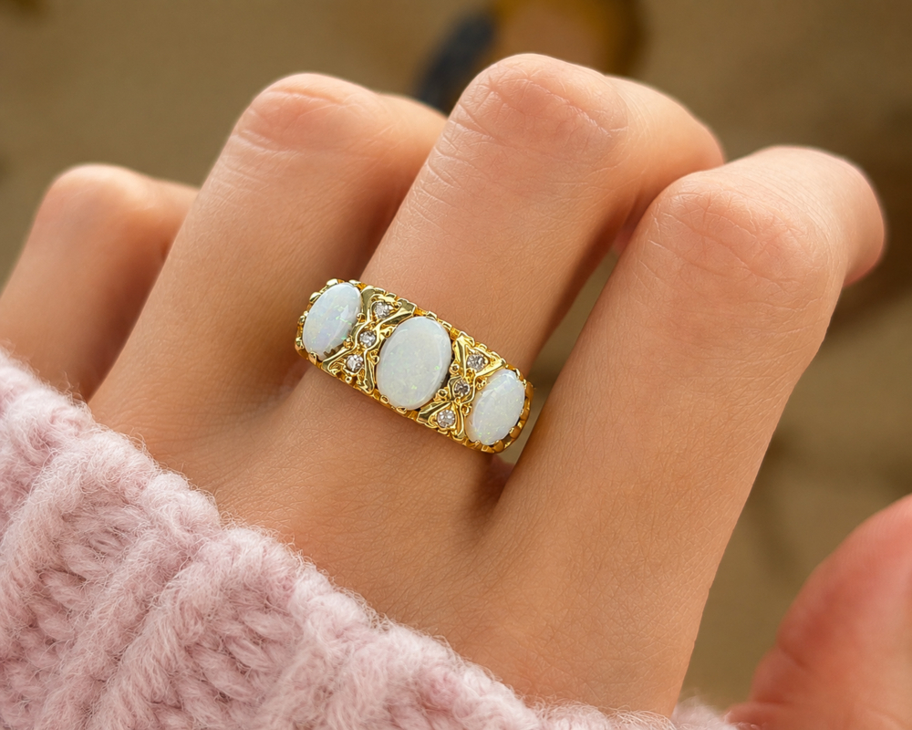 vintage three stone opal and diamond ring in 18ct yellow gold for sale in Leeds, shown on hand