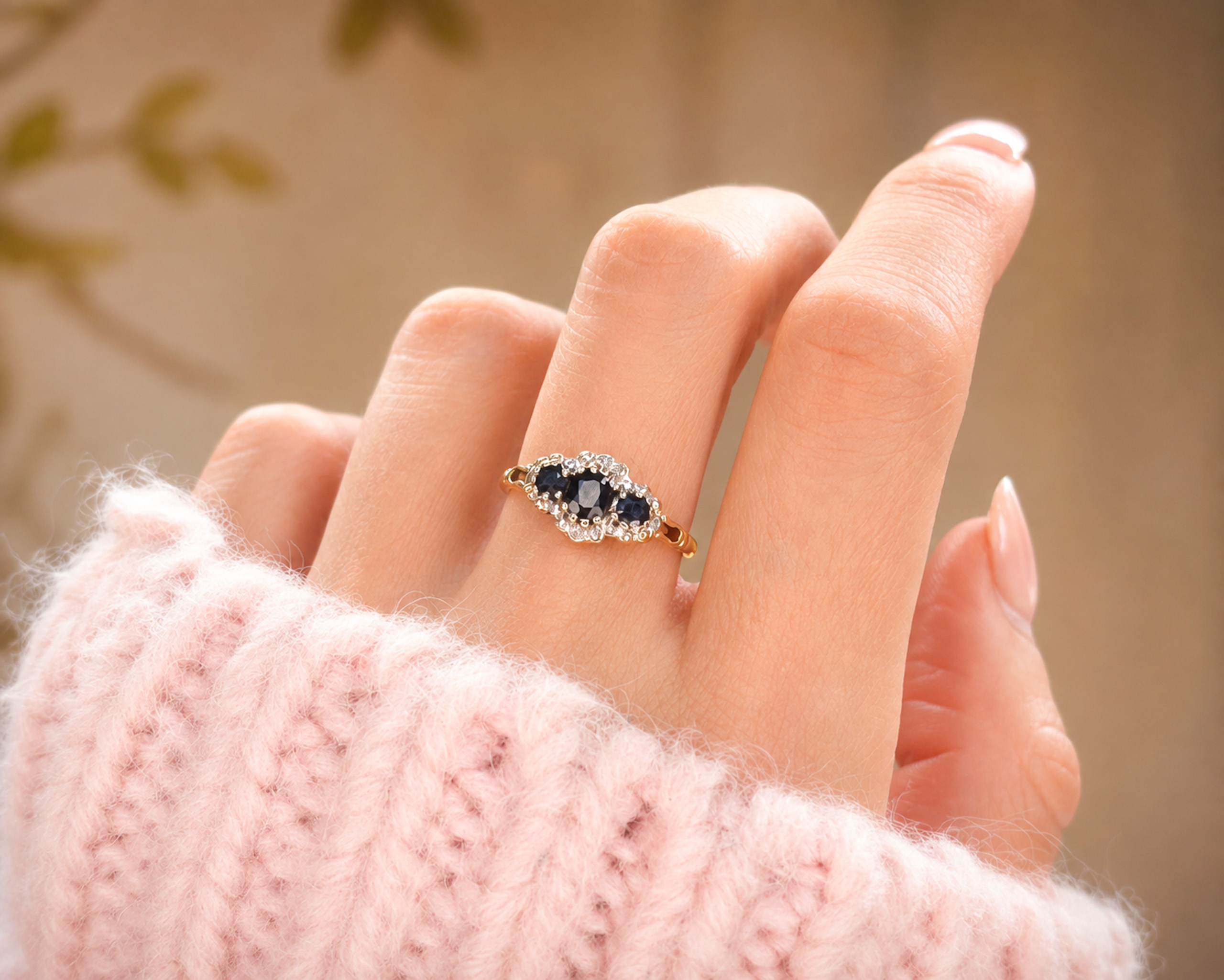 vintage 9ct gold sapphire and diamond ring for sale in Leeds, shown on model's hand