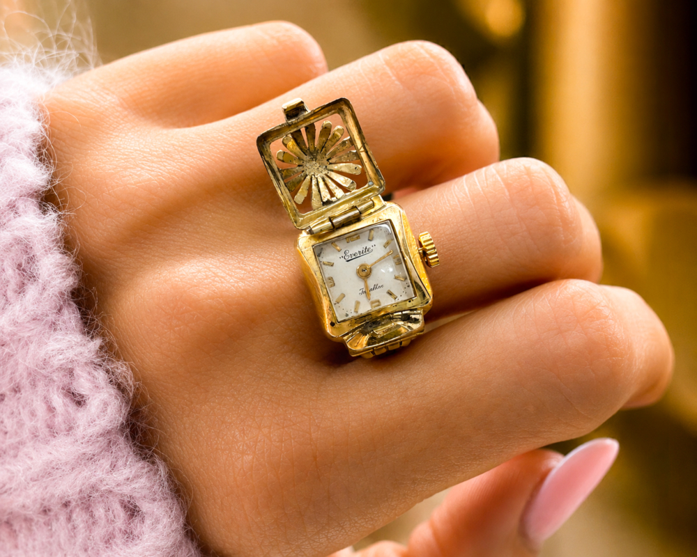 vintage gold metal ring watch circa 1950s/60s shown open on a model's hand