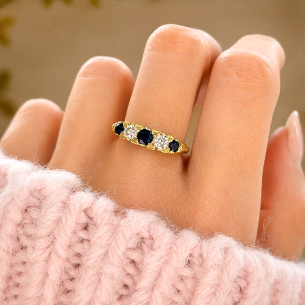 vintage 1960s sapphire and diamond five stone ring in 18ct yellow gold for sale in Leeds, shown on model