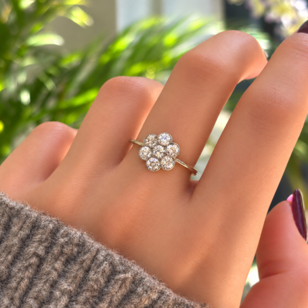 antique Art Deco daisy cluster ring 1ct in 18ct gold for sale in Leeds on a hand