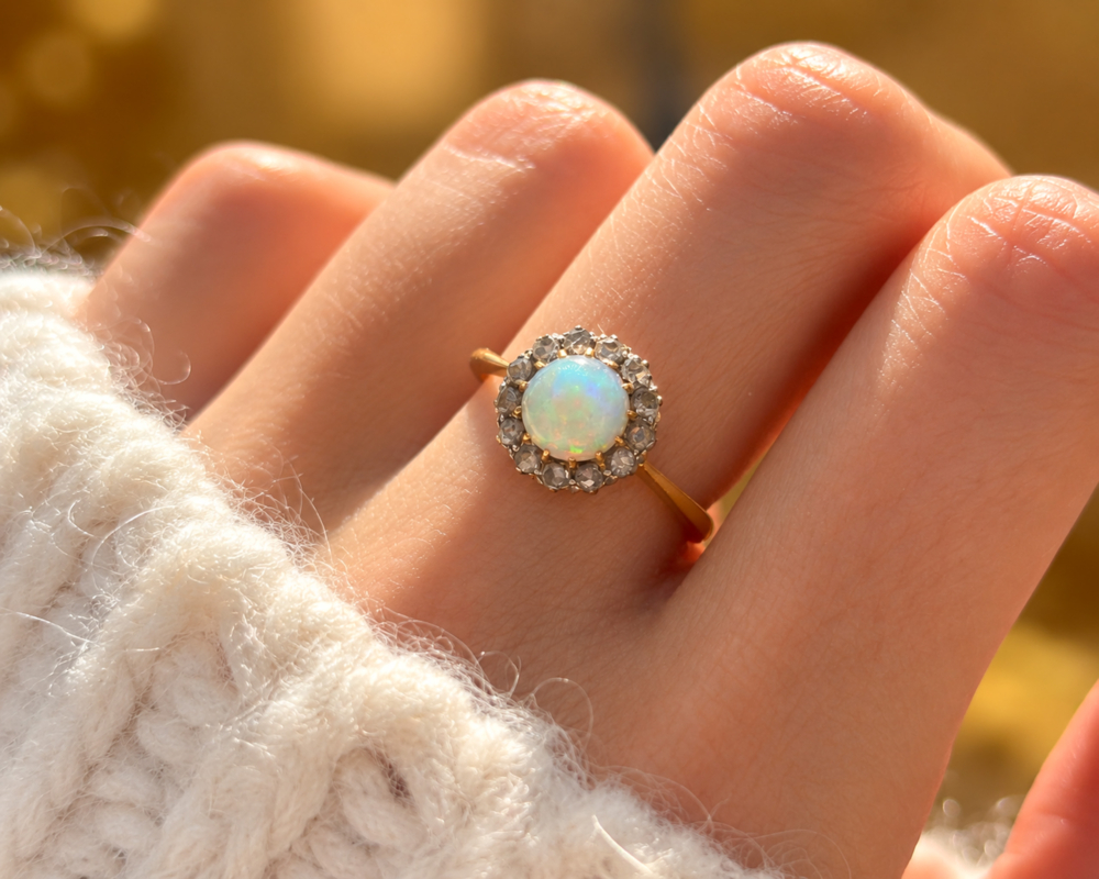 Antique Victorian opal and rose cut diamond ring in 18ct yellow gold and platinum for sale in Leeds on a finger