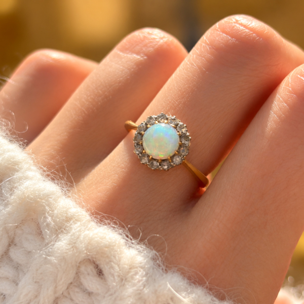 Antique Victorian opal and rose cut diamond ring in 18ct yellow gold and platinum for sale in Leeds on a finger
