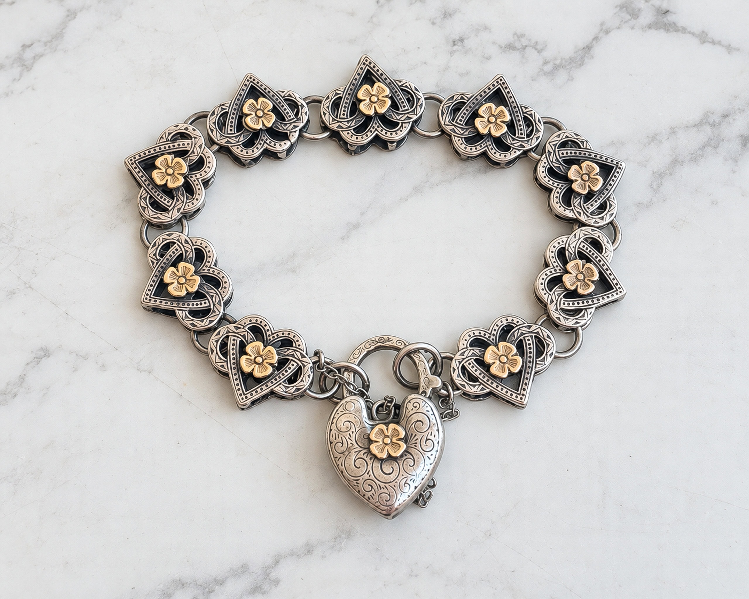 antique Victorian 9ct gold and silver heart padlock bracelet for sale in Leeds
