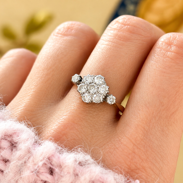 Art Deco diamond daisy cluster ring in 18ct yellow gold and platinum for sale in Leeds on hand
