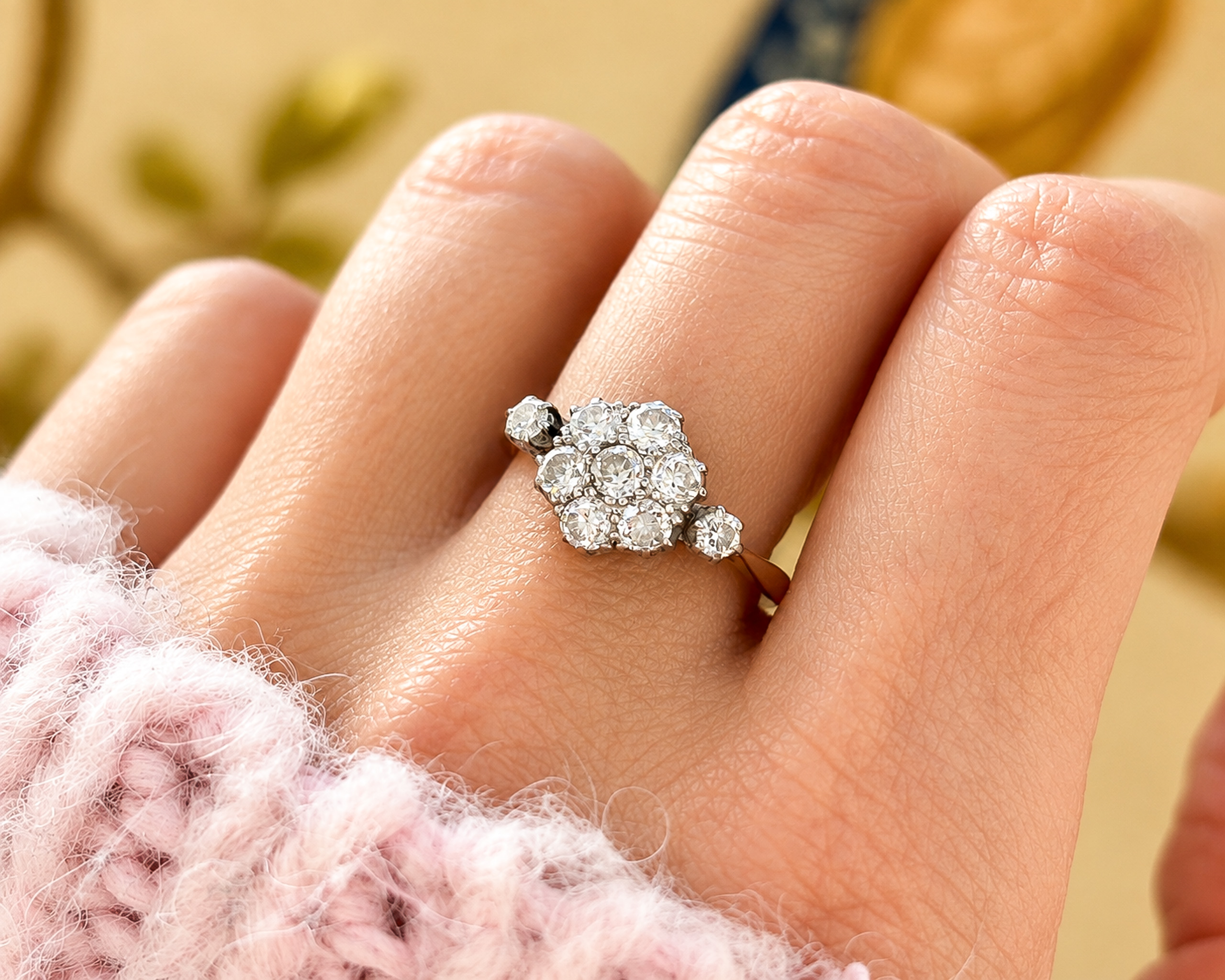 art deco daisy cluster ring on hand
