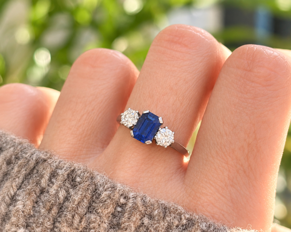 antique Art Deco Burmese sapphire ad diamond three stone ring for sale in Leeds on a model's hand