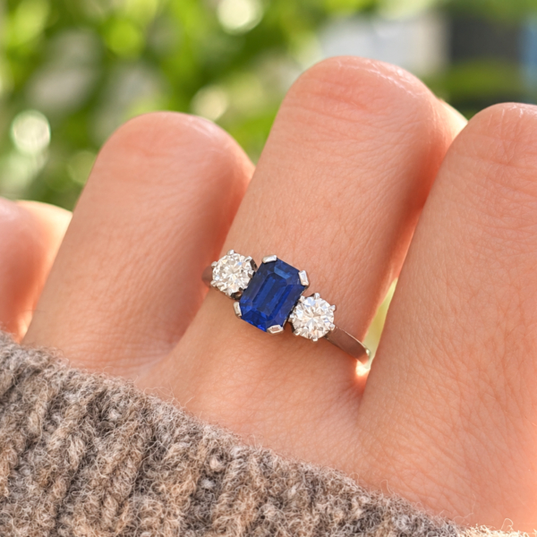 antique Art Deco Burmese sapphire ad diamond three stone ring for sale in Leeds on a model's hand