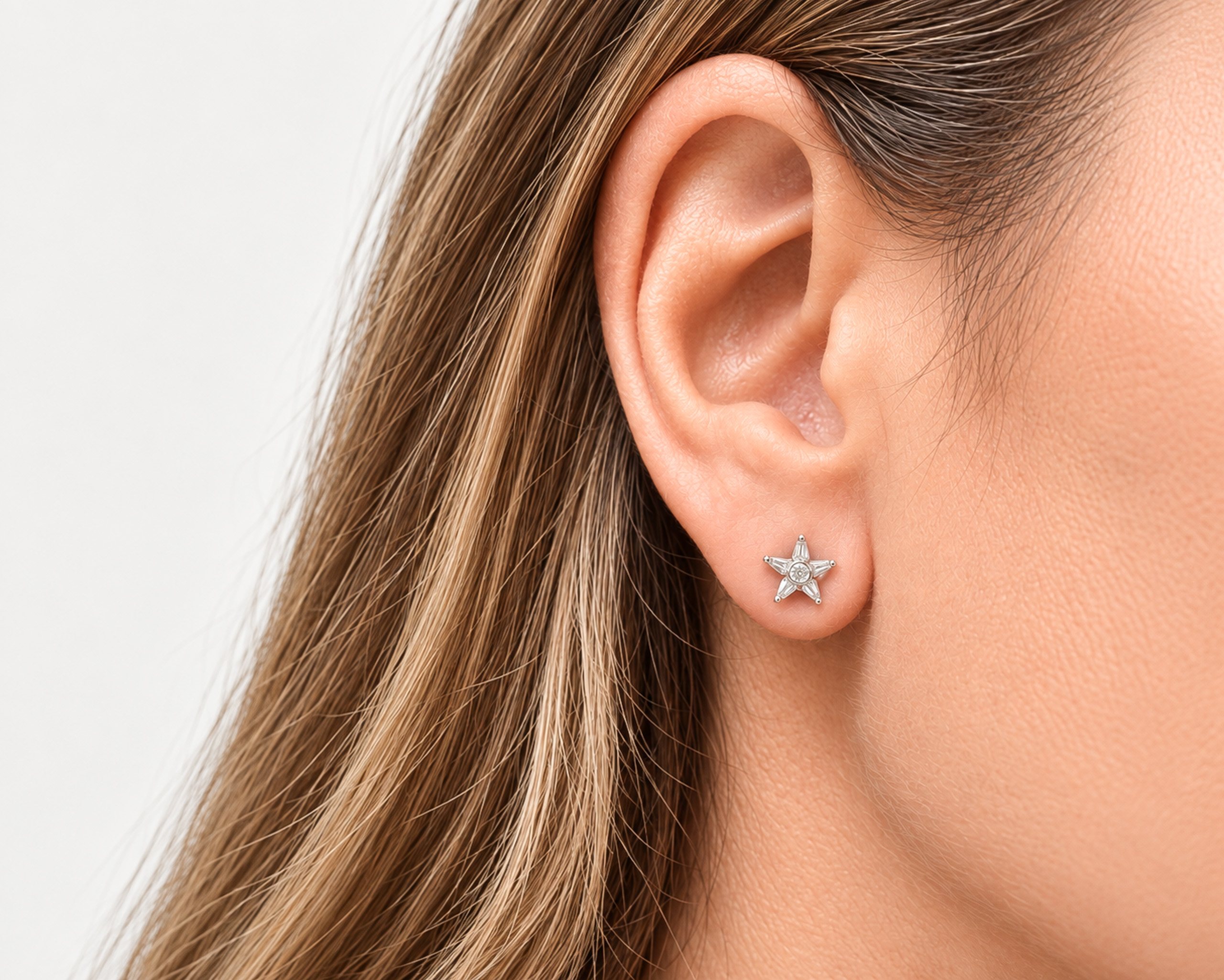 diamond star studs in ear