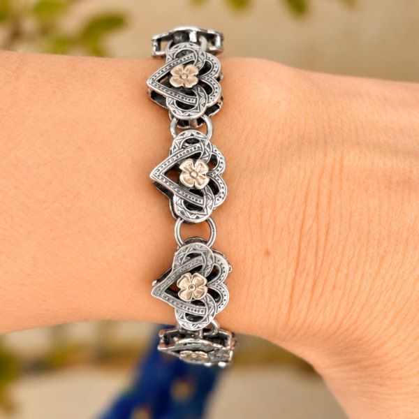 antique Victorian 9ct gold and silver heart padlock bracelet for sale in Leeds on a hand