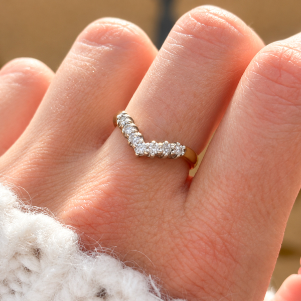 vintage diamond wishbone ring in 9ct yellow gold for sale in Leeds, shown on a hand