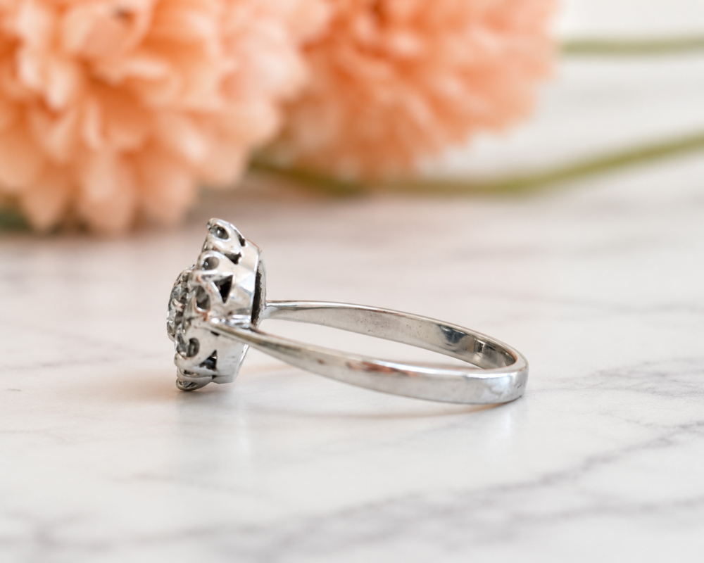 vintage flower diamond cluster ring in 18ct white gold with 1.25ct for sale in Leeds, showing the side of the ring