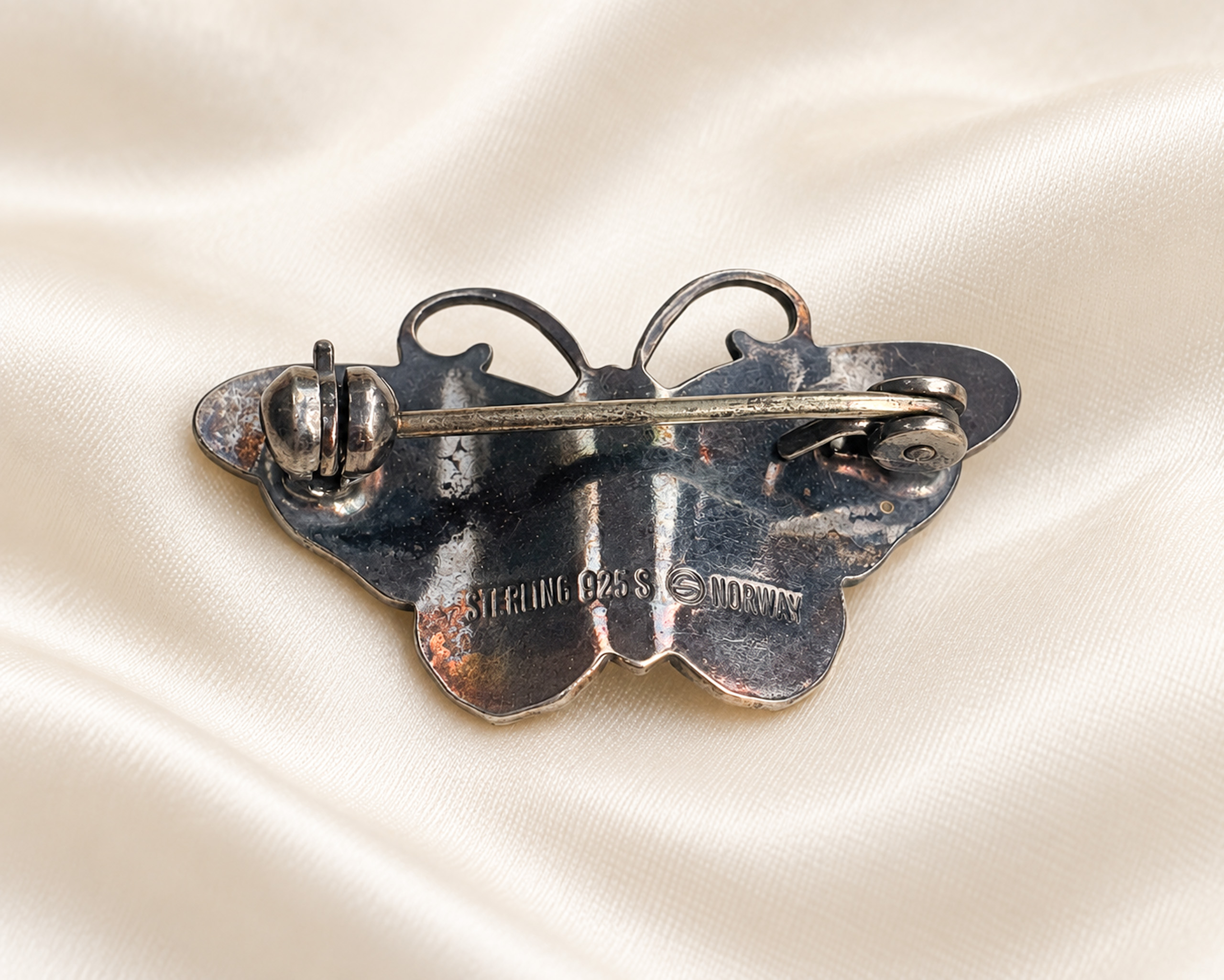 white butterfly brooch back