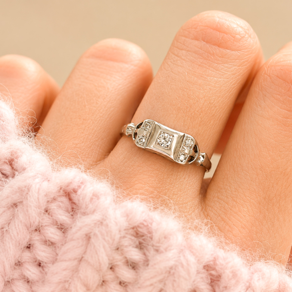 art deco diamond plaque ring in 18ct white gold for sale in Leeds shown on a model's hand