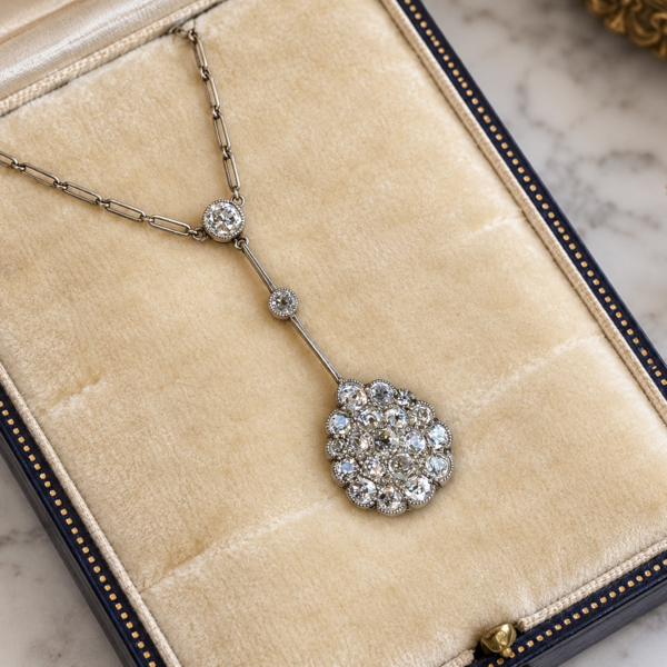antique Edwardian old cut diamond necklace in platinum, displayed in an antique box